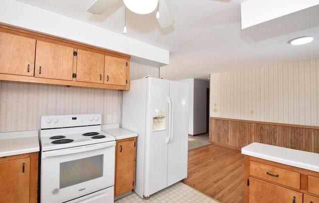 kitchen featuring ceiling fan and white appliances