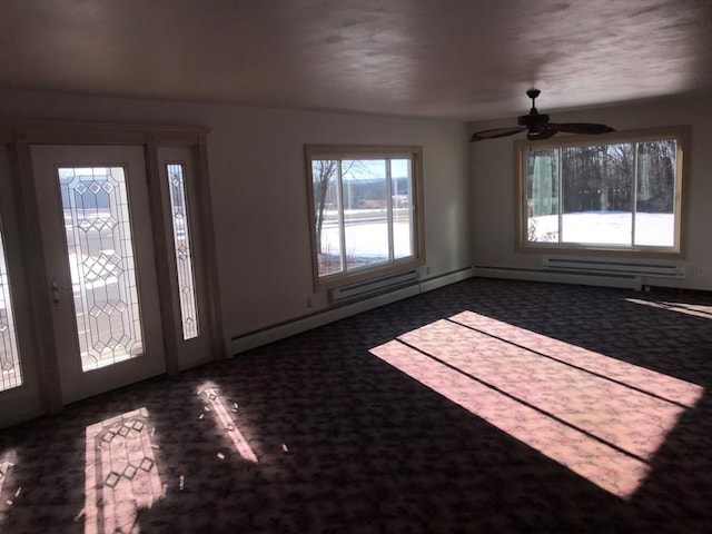 foyer with dark colored carpet and ceiling fan