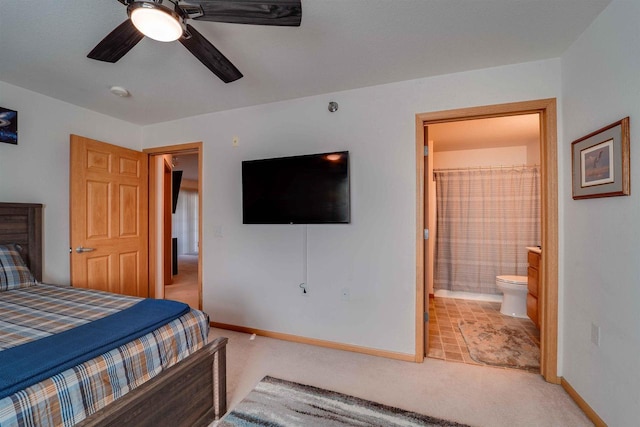 carpeted bedroom featuring ceiling fan and connected bathroom