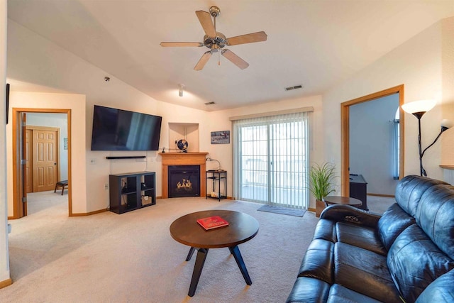 living room with lofted ceiling, carpet flooring, and ceiling fan