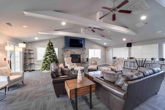 carpeted living room with lofted ceiling with beams, ceiling fan, and a fireplace