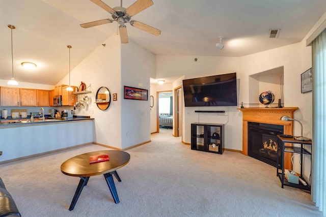 carpeted living room featuring lofted ceiling and ceiling fan