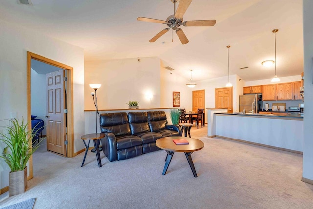 carpeted living room featuring lofted ceiling and ceiling fan