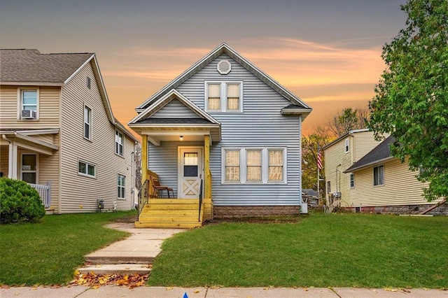 view of front of house with a lawn