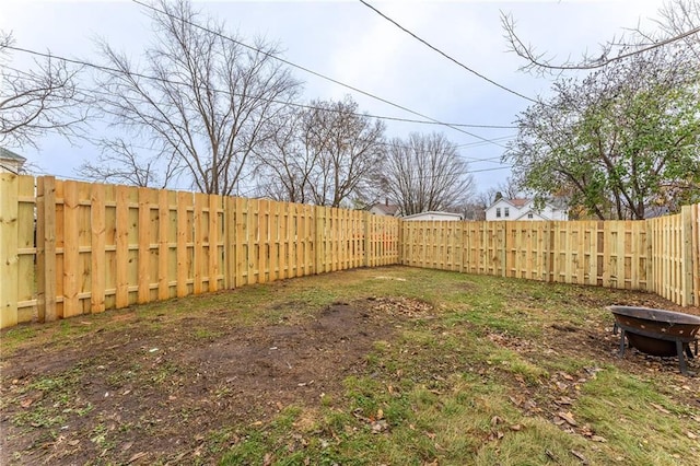 view of yard featuring a fire pit