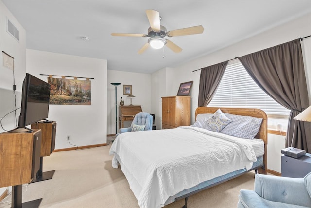 bedroom featuring light colored carpet and ceiling fan