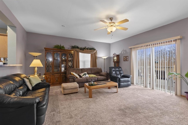 living room with carpet flooring and ceiling fan