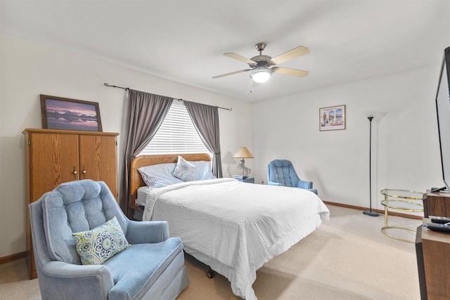 bedroom featuring light colored carpet and ceiling fan