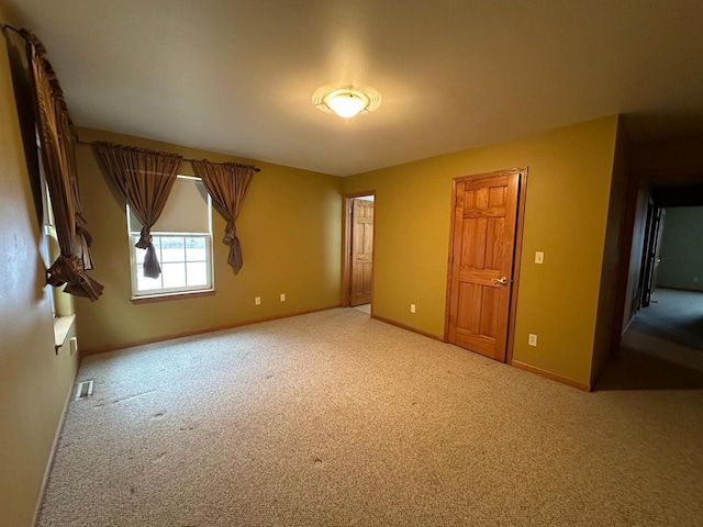 unfurnished bedroom featuring carpet floors