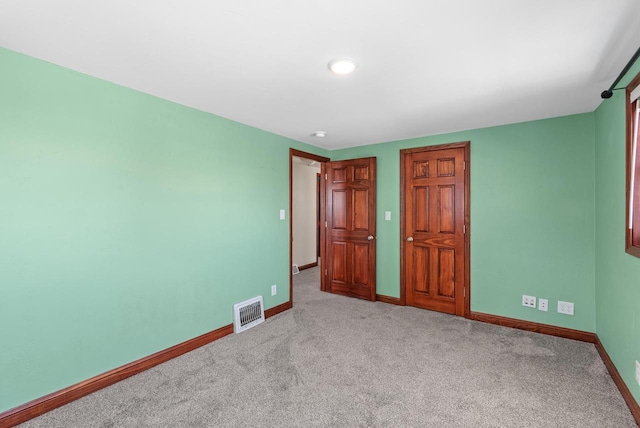 unfurnished bedroom with light carpet