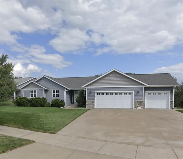 single story home with a garage and a front yard