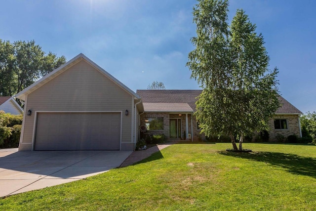 view of front of property featuring concrete driveway, brick siding, an attached garage, and a front yard