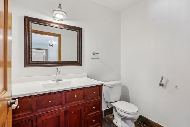 8209 N Port Washington Rd, Fox Point, WI 53217 - half bath with toilet, tile patterned floors, and vanity