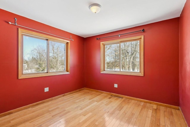 8209 N Port Washington Rd, Fox Point, WI 53217 - empty room with baseboards and wood finished floors