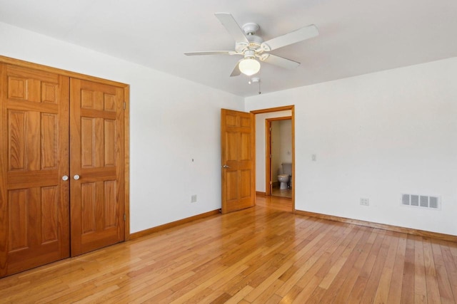 8209 N Port Washington Rd, Fox Point, WI 53217 - unfurnished bedroom featuring light wood-type flooring, a closet, visible vents, and baseboards