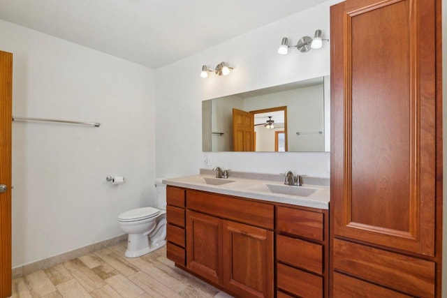 8209 N Port Washington Rd, Fox Point, WI 53217 - full bathroom with toilet, ceiling fan, double vanity, and a sink