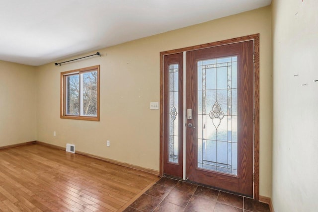 8209 N Port Washington Rd, Fox Point, WI 53217 - foyer with dark wood-style floors, baseboards, and visible vents