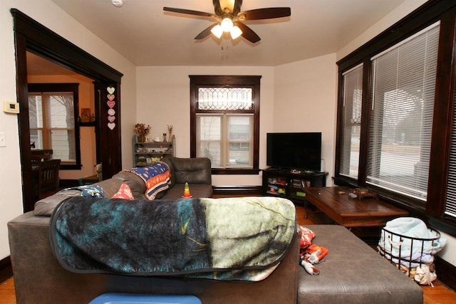 living room with hardwood / wood-style flooring and ceiling fan