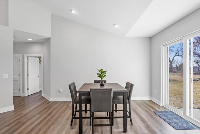 dining area with hardwood / wood-style flooring