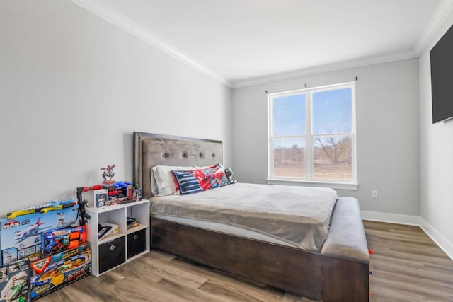 bedroom with crown molding and wood-type flooring