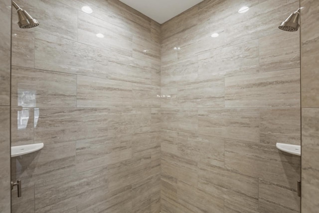 bathroom with tiled shower