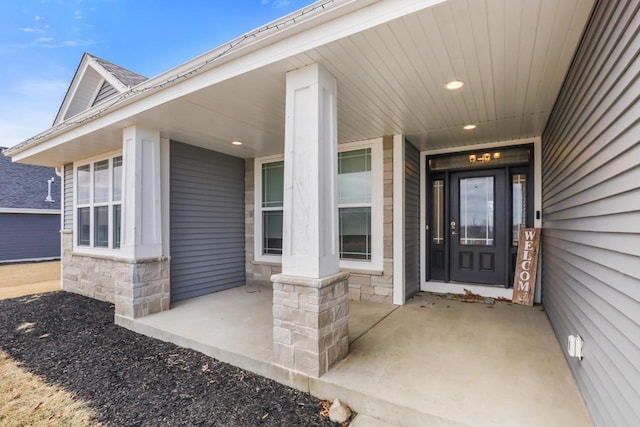 doorway to property featuring covered porch