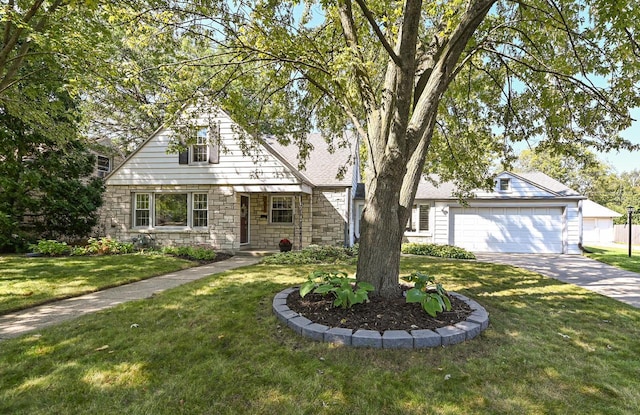 view of front of property featuring a garage and a front lawn