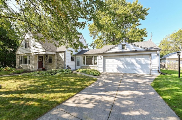 view of front facade with a garage and a front lawn