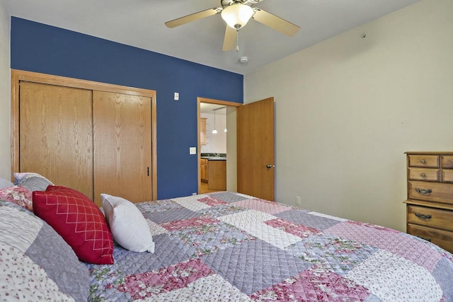 bedroom featuring ceiling fan and a closet