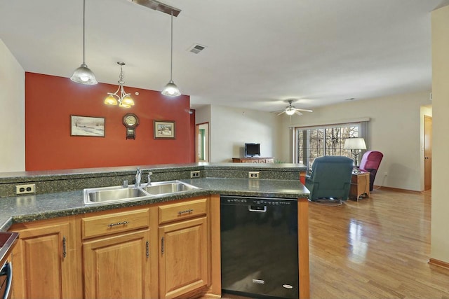 kitchen featuring pendant lighting, sink, ceiling fan, dishwasher, and light wood-type flooring