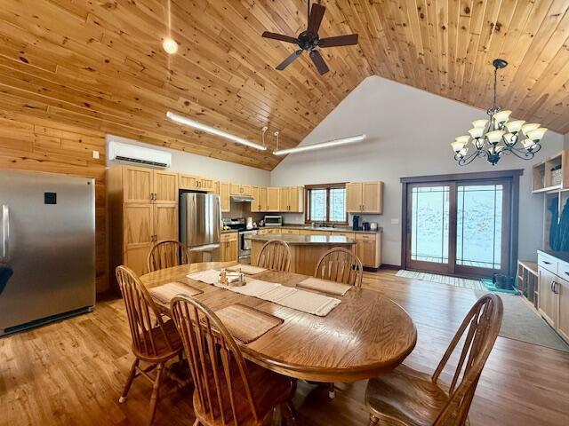 dining space with ceiling fan with notable chandelier, a wall mounted air conditioner, high vaulted ceiling, wood ceiling, and light hardwood / wood-style floors