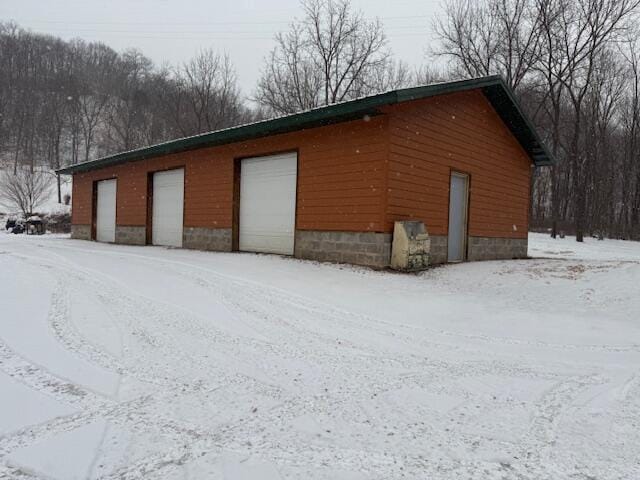 view of snow covered garage