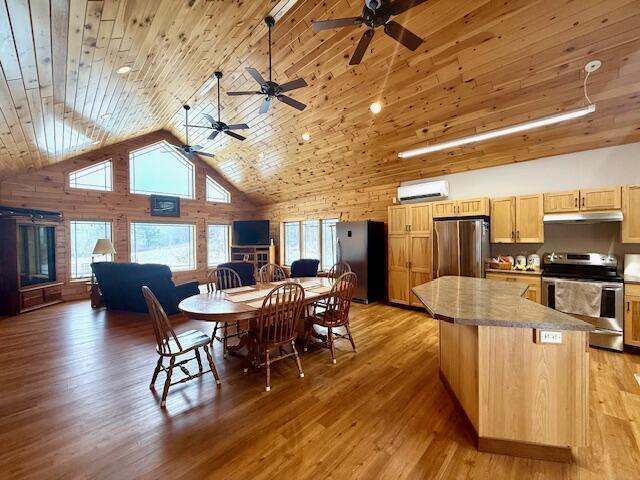 dining area with high vaulted ceiling, light hardwood / wood-style floors, a wall mounted air conditioner, and wooden ceiling