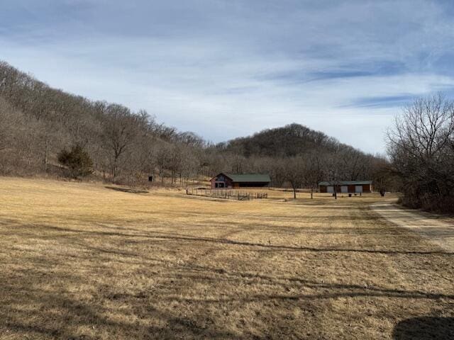 exterior space with a rural view and a mountain view