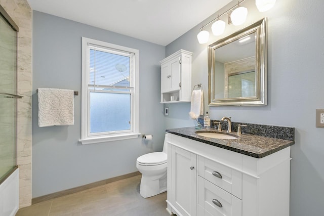 full bathroom with enclosed tub / shower combo, vanity, and toilet