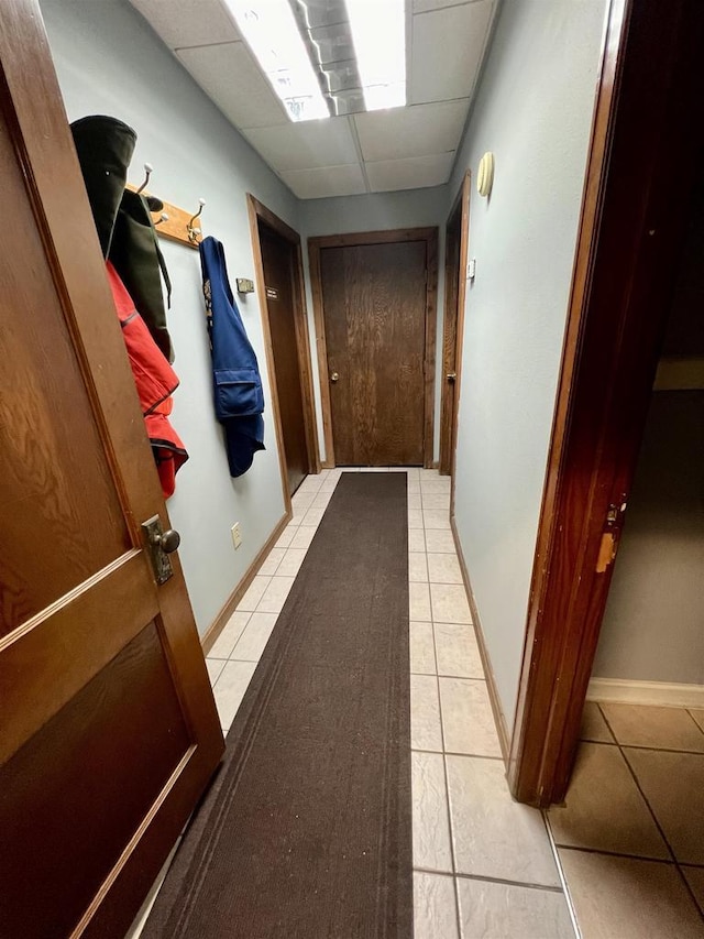 202 N Wisconsin Ave, Muscoda, WI 53573 - hall featuring light tile patterned floors and a drop ceiling
