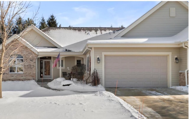 view of front of house featuring a garage and a porch