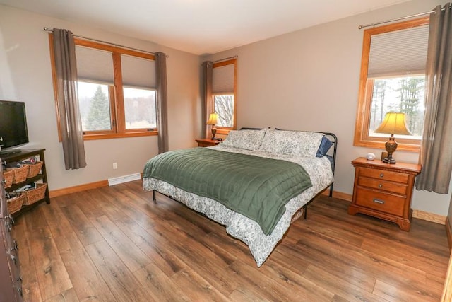 bedroom with wood-type flooring