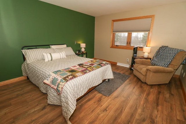 bedroom featuring dark hardwood / wood-style flooring