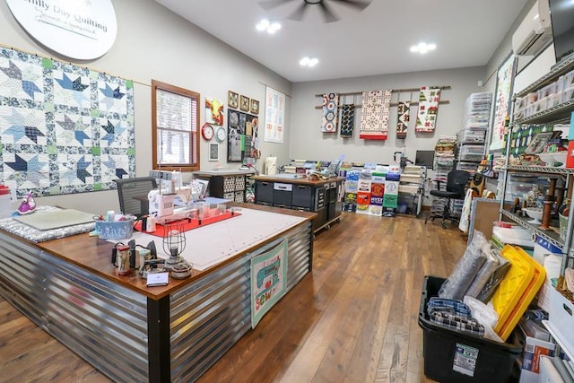 office area with ceiling fan and dark hardwood / wood-style flooring