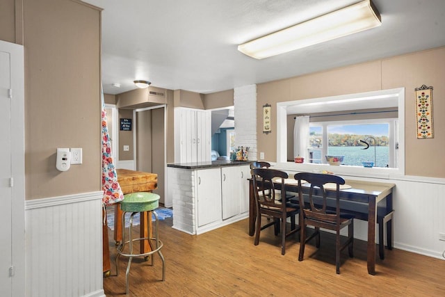 kitchen with white cabinetry and light wood-type flooring