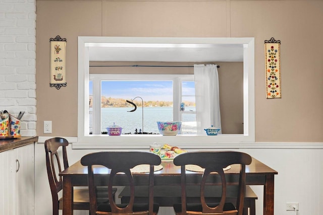 dining room featuring a water view