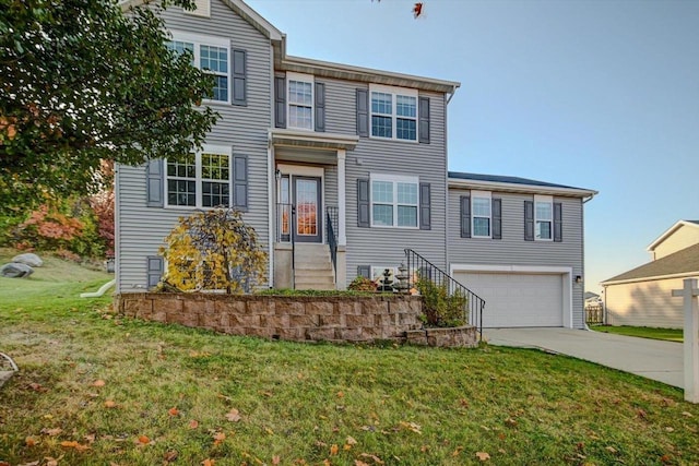 view of front of property featuring a garage and a front yard