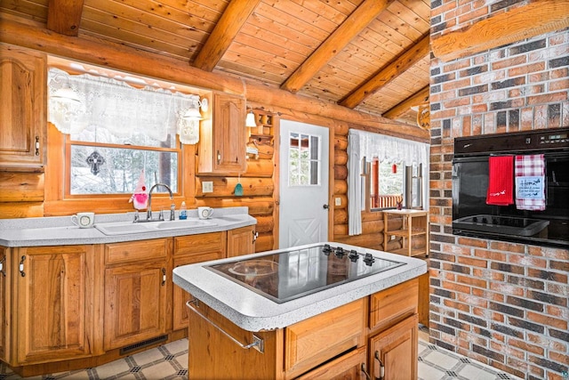 kitchen featuring a kitchen island, lofted ceiling with beams, sink, black appliances, and wooden ceiling