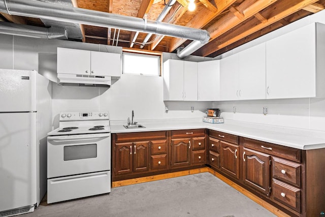 kitchen featuring white appliances, dark brown cabinetry, sink, and white cabinets