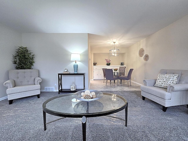 living room with a notable chandelier