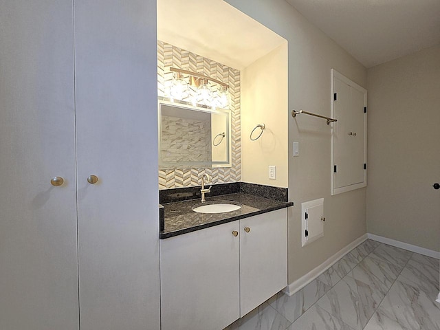 bathroom with vanity and backsplash