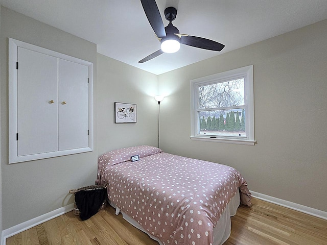 bedroom featuring ceiling fan and light hardwood / wood-style floors