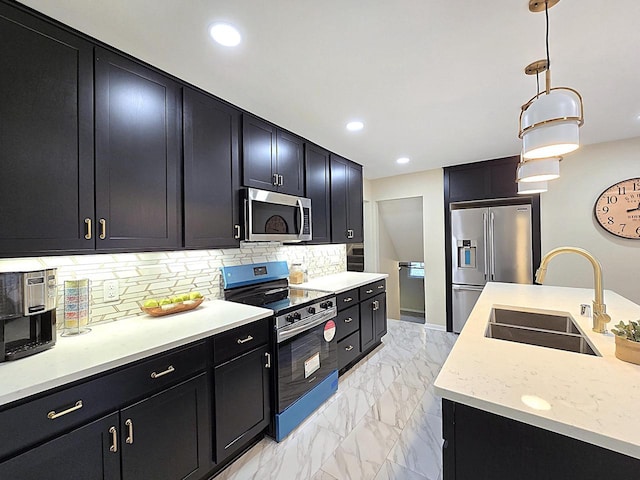 kitchen featuring appliances with stainless steel finishes, decorative light fixtures, tasteful backsplash, sink, and light stone counters