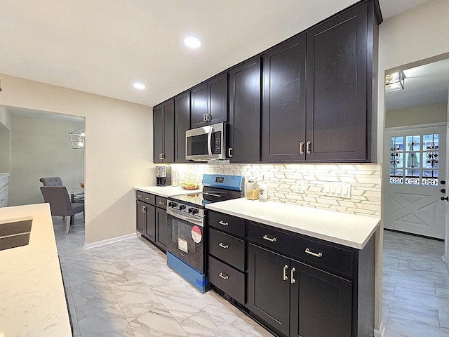 kitchen with tasteful backsplash and stainless steel appliances